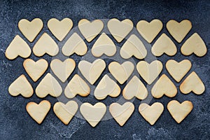 Heart shaped cookies for valentine`s day on dark background. Close up