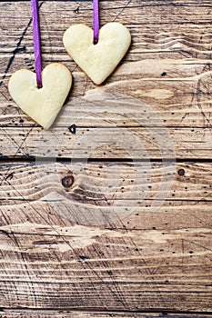 Heart shaped cookies for valentine`s day on wooden background. Copy space