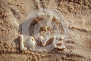 Heart shaped coral and the word LOVE on sand, Boracay Island, Philippines