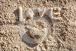 Heart shaped coral and the word LOVE on sand, Boracay Island, Philippines