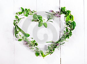 Heart shaped frame of fresh culinary herbs