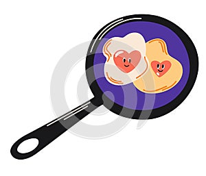 Heart-shaped fried eggs in a frying pan. Fried egg in the shape of a heart Valentine Day lovers breakfast.