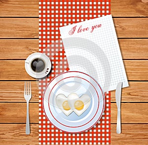 Heart shaped fried eggs on white plate with i love you text