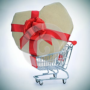 Heart-shaped gift in a shopping cart