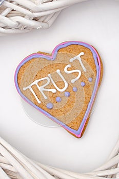 Heart shaped gingerbread with text and gray/white background. Valentines day symbol