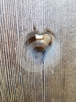 Heart shaped hole in wood