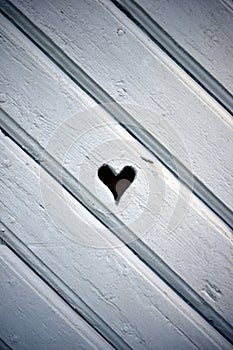 Heart shaped hole in wooden shutter