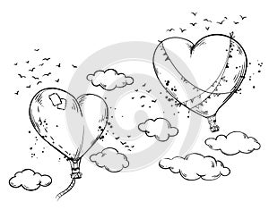 Heart shaped hot air baloons soaring in the air among clouds, romantic atmosphere