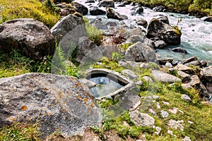 Heart shaped hotsprings near the mountain river