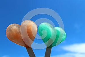 Heart shaped ice in front of the summer sky