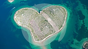 Heart shaped island of Galesnjak in Zadar archipelago aerial drone view,