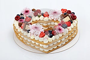 Heart shaped layer cake on white background