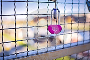 Heart-shaped lock on the fence - the symbol of love