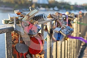 Heart-shaped locks on the railing of the bridge. A symbol of eternal love on the wedding day. A romantic tradition