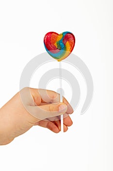 Heart shaped lollipop on white