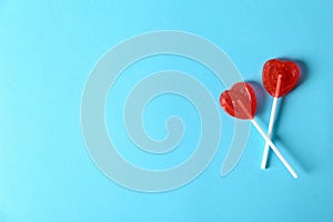 Heart shaped lollipops and space text color background