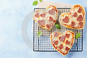 Heart shaped mini pizza. Valentines day romantic menu