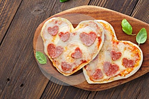 Heart shaped mini pizza. Valentines day romantic menu