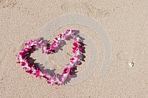 Heart shaped orchid flower garland white sea sand beach
