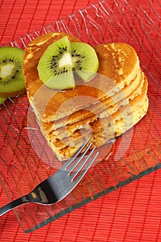 Heart-shaped pancakes with kiwi fruit