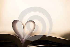 Heart-shaped paper inside a book.