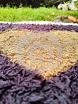 Heart-Shaped Pattern on Textured Dark and Light Fabric Close-Up