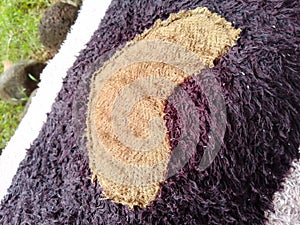 Heart-Shaped Pattern on Textured Dark and Light Fabric Close-Up