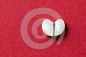 Heart shaped pill cracked in half