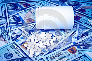 Heart-shaped pills on the background of hundred-dollar bills. The concept of the expensive cost of healthcare or financing