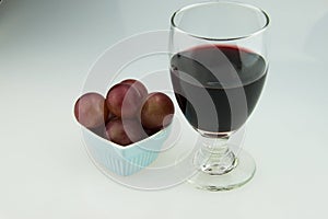 Heart shaped plate, grapes, red wine, wine glass