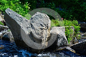 Heart shaped rock in Edith Creek on the side of Mt Rainier, Paradise area at Mt. Rainier national park, as a nature background