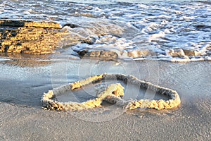 Heart-shaped rope on the beach