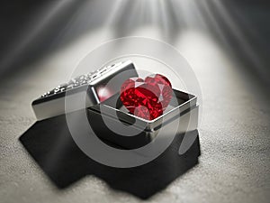 Heart-shaped ruby in an open box