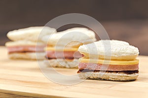 Heart shaped sandwich recipe, ingredients with sauces on a wooden board. Close up, selective focus