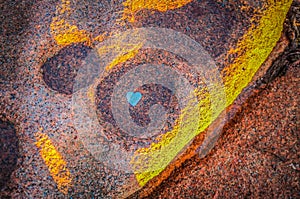 Heart shaped shell in rock pool at sunset at Honeymoon Bay Tasmania, Australia