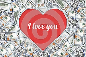 Heart shaped sign made with many 100 dollar banknotes isolated on white