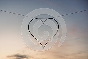 Heart-Shaped Silhouette Hanging Against a Serene Twilight Sky