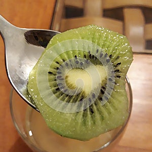 A heart-shaped slice of fresh Kiwi fruit