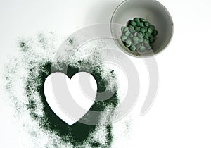 Heart-shaped spirulina powder and tablets