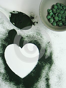 Heart-shaped spirulina powder and tablets