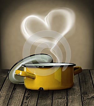 Heart shaped steam above a yellow pot