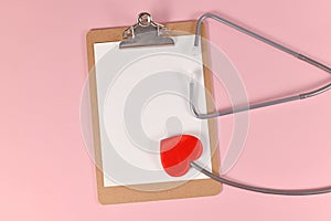 Heart shaped stethoscope with empty clipboard