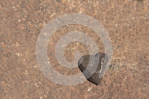 A heart-shaped stone with space for texts, copy space