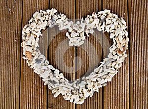 Heart shaped stones on old striped wood planks