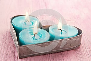 Heart shaped tray with romantic candles photo