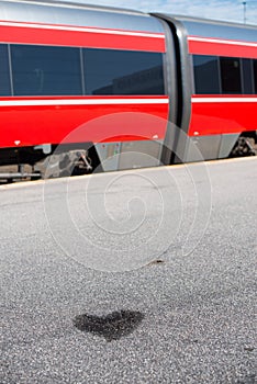 Heart shaped water spillage in front of a train
