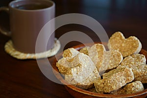 Heart-shaped wholemeal cookies and cup of tea