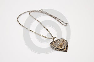 Heart-shaped woman's gold necklace