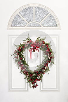 Heart Shaped Wreath Hanging on White Door