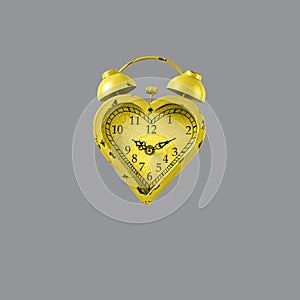 Heart shaped yellow clock on gray background. Valentines day and love infitity and duration concept